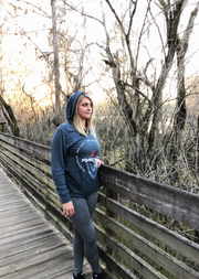 Young woman on boardwalk wearing young once pullover hoody